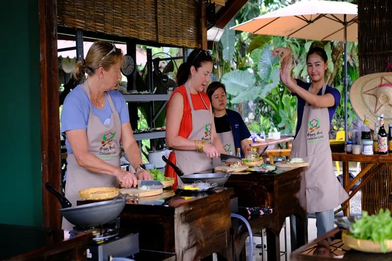 Happy Herb students cooking and sharing the experience