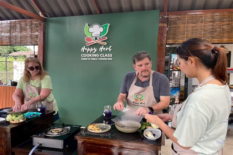 Small group finishing their Thai recipes together