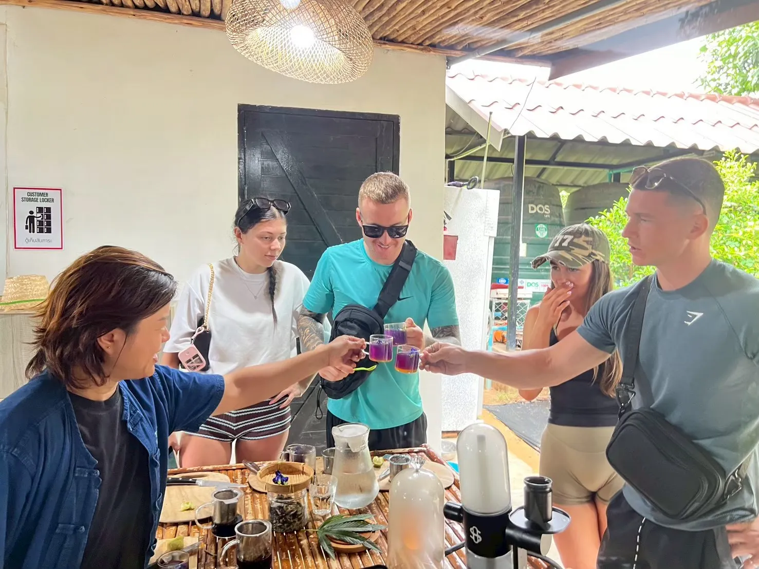 Tour guests enjoying Thai herbal tea at the farm