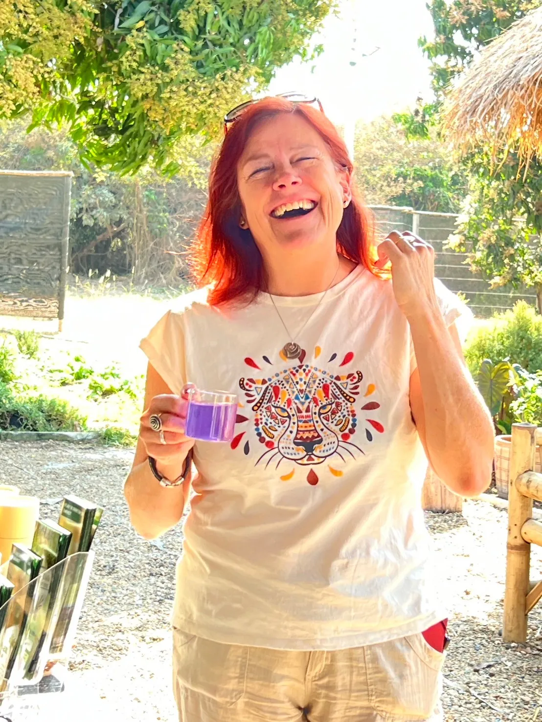 Guest enjoying a purple Thai herbal drink after the farm walk