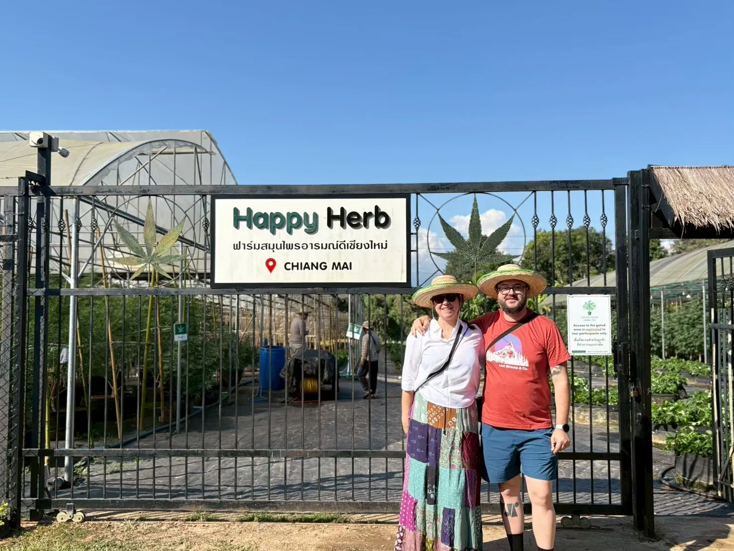 Couple beginning their cannabis farm visit at the entrance